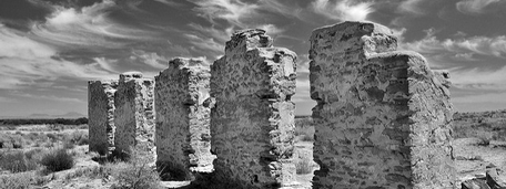 View of the ruined stone walls of the Fort Craig Historic Site in black and white.